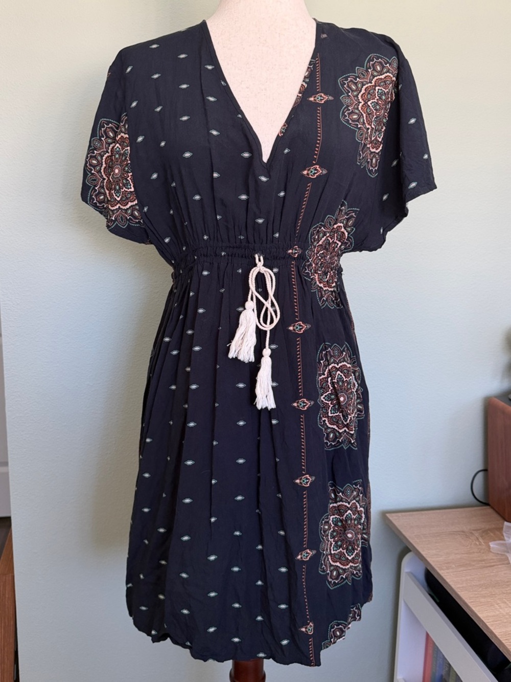 EARTHBOUND Black V-Neck Tassel-Waist Mini Dress with Medallion Print